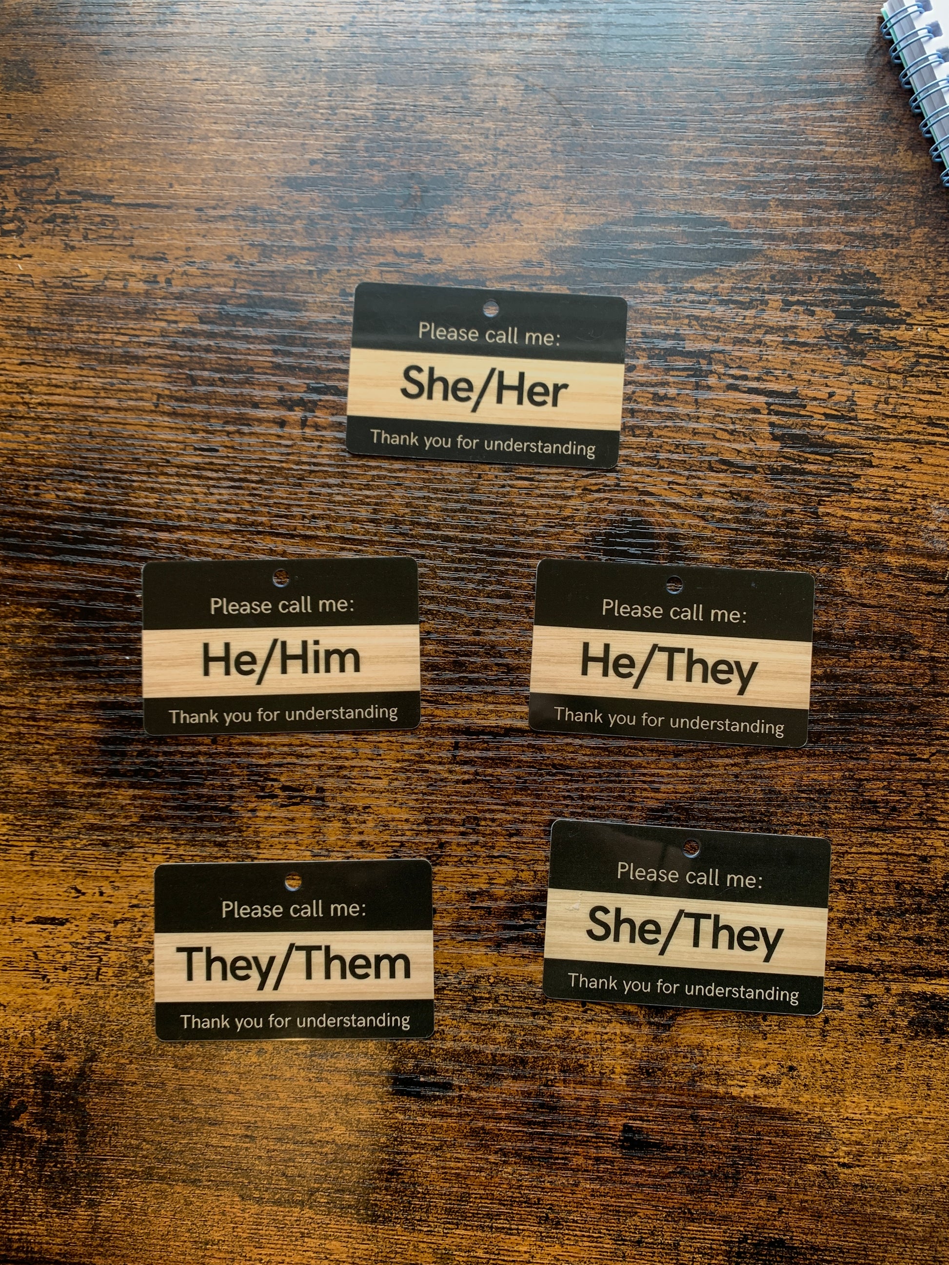 Set of pronoun cards on a wooden surface